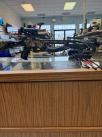 barnett jackal crossbow with arrows and a scope 