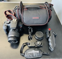 Canon EOS Rebel T100 DSLR Camera with 18-55 Lens, Charger, Bag & Accessories 